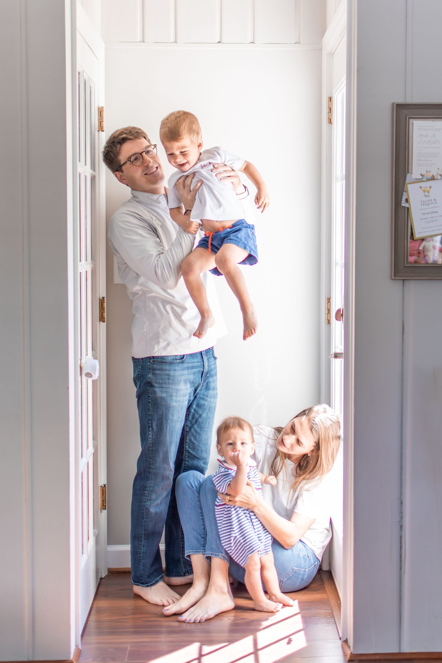 A Winston-Salem family plays together in a light-filled alcove in their home.
