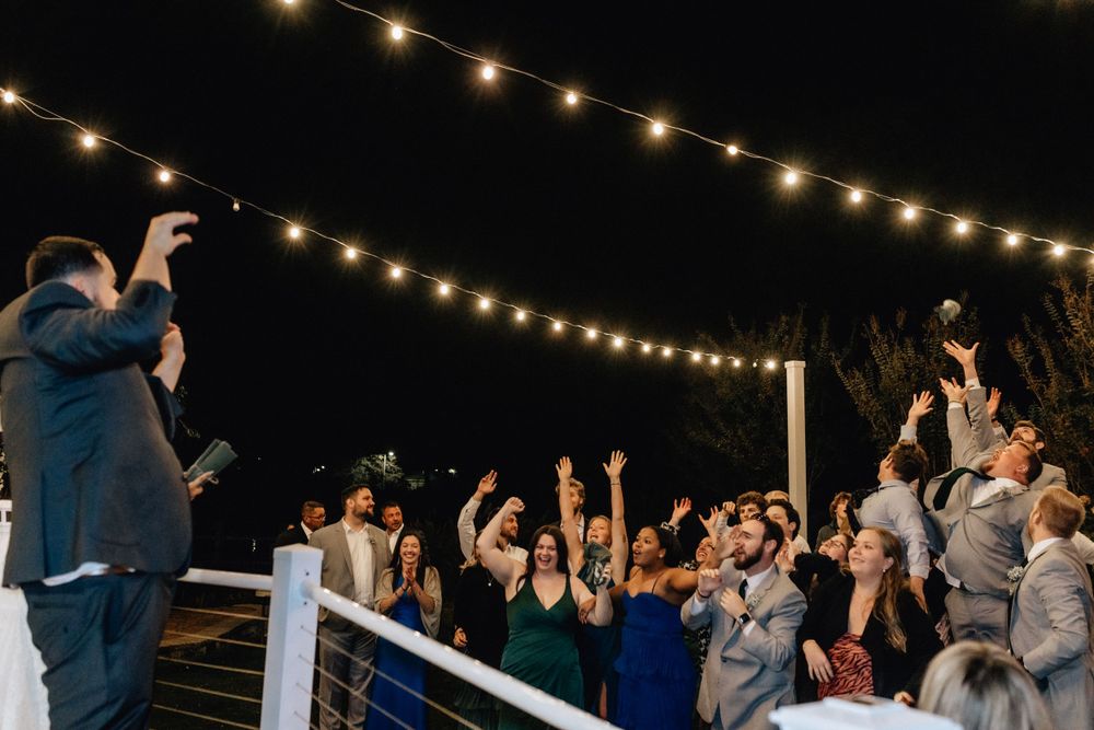t shirt toss at newport news, virginia wedding groom tossing t shirt into reception crowd