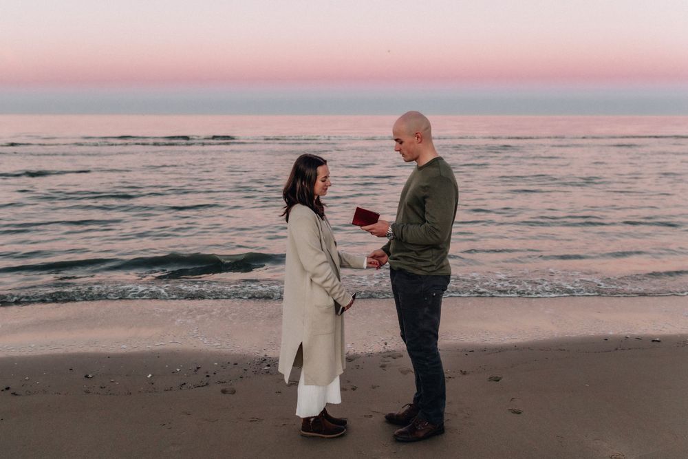 couple reading vows on the beach in virginia beach, virginia  micro wedding and elopement