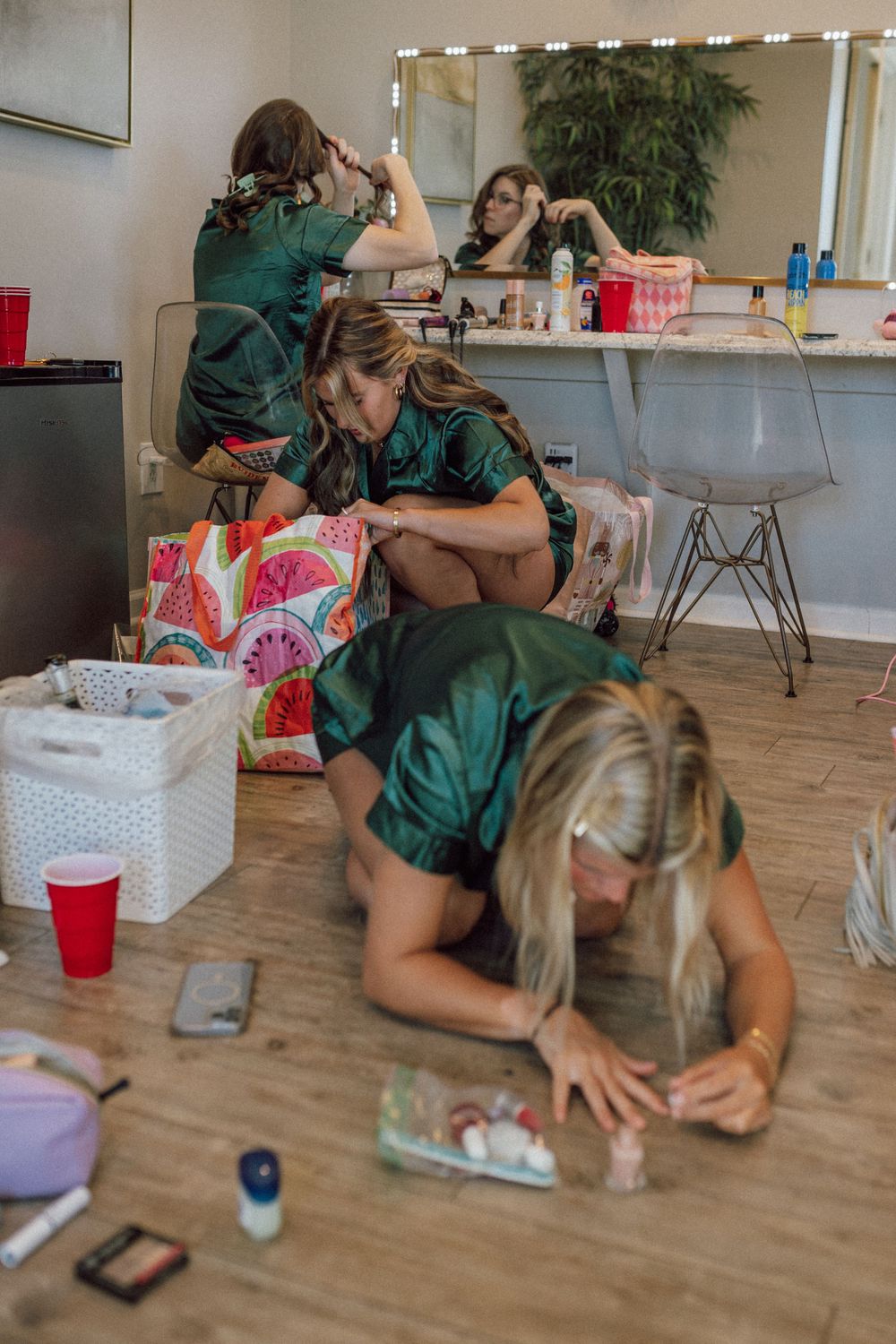 bridesmaids on the floor of bridal suite getting ready for wedding ceremony in newport news, virginia micro wedding