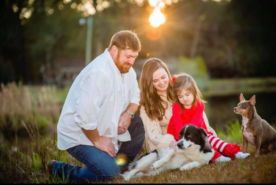 sunset golden hour photo Andalusia Alabama family session with their dogs fun moment captured on location farm land