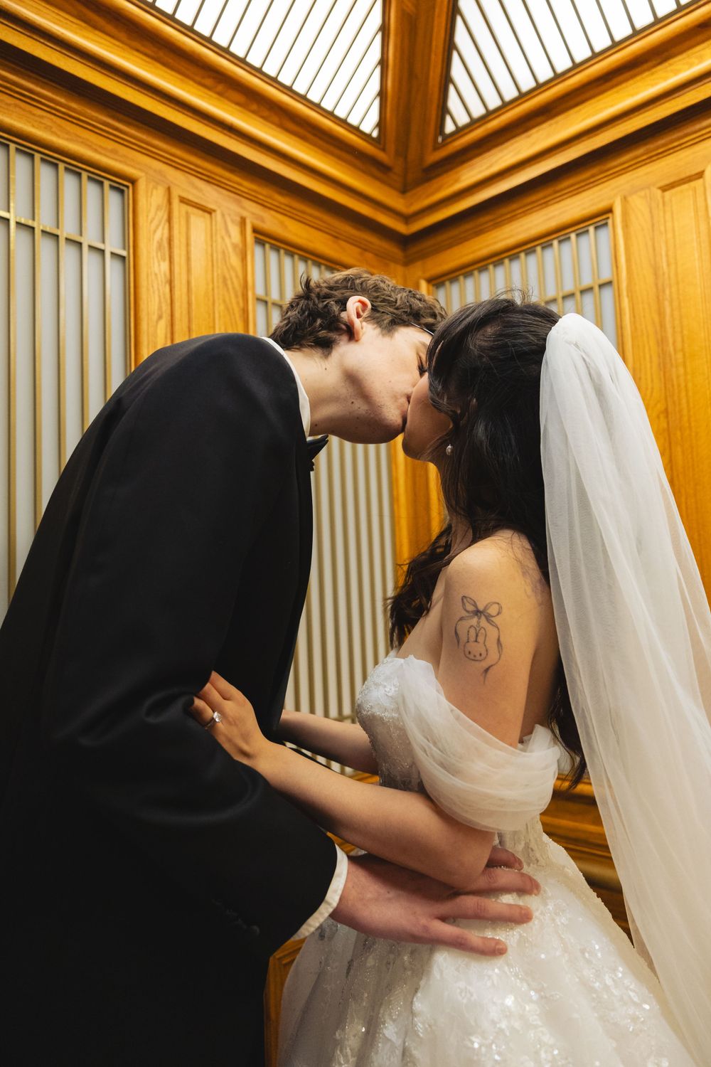 Wedding portrait photograph bride and groom inside San Francisco City Hall, photographed by a Bay Area portrait photographer.