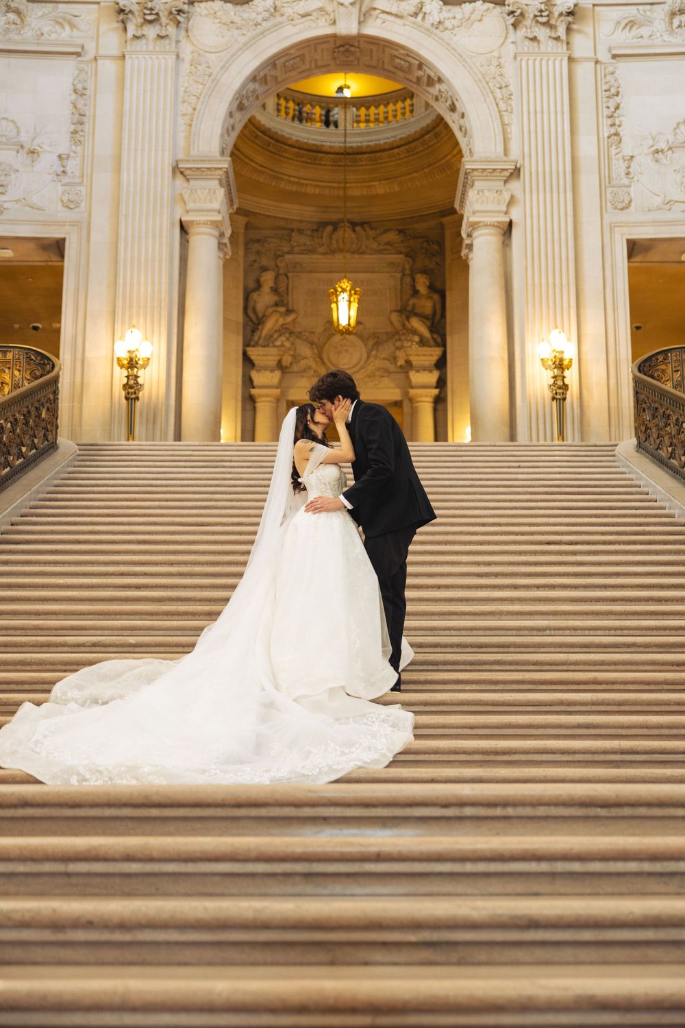 Wedding portrait photograph bride and groom inside San Francisco City Hall, photographed by a Bay Area portrait photographer.