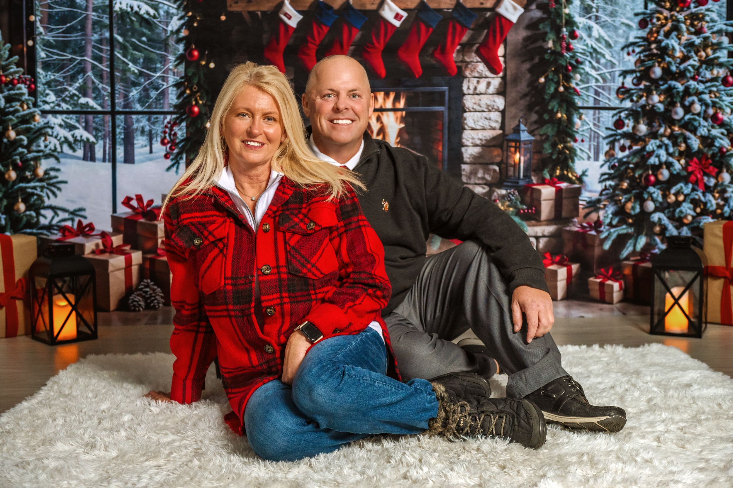 Family Christmas portraits with festive decorations and red accents in studio setting.
