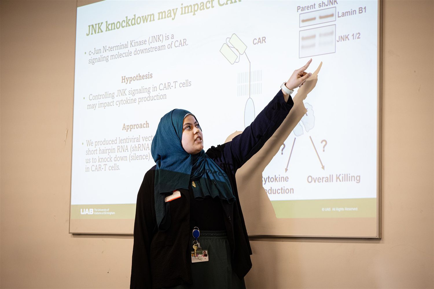 Researcher giving an oral presentation at UAB Expo, UAB corporate event photography, affordable Birmingham Alabama event photographer.
