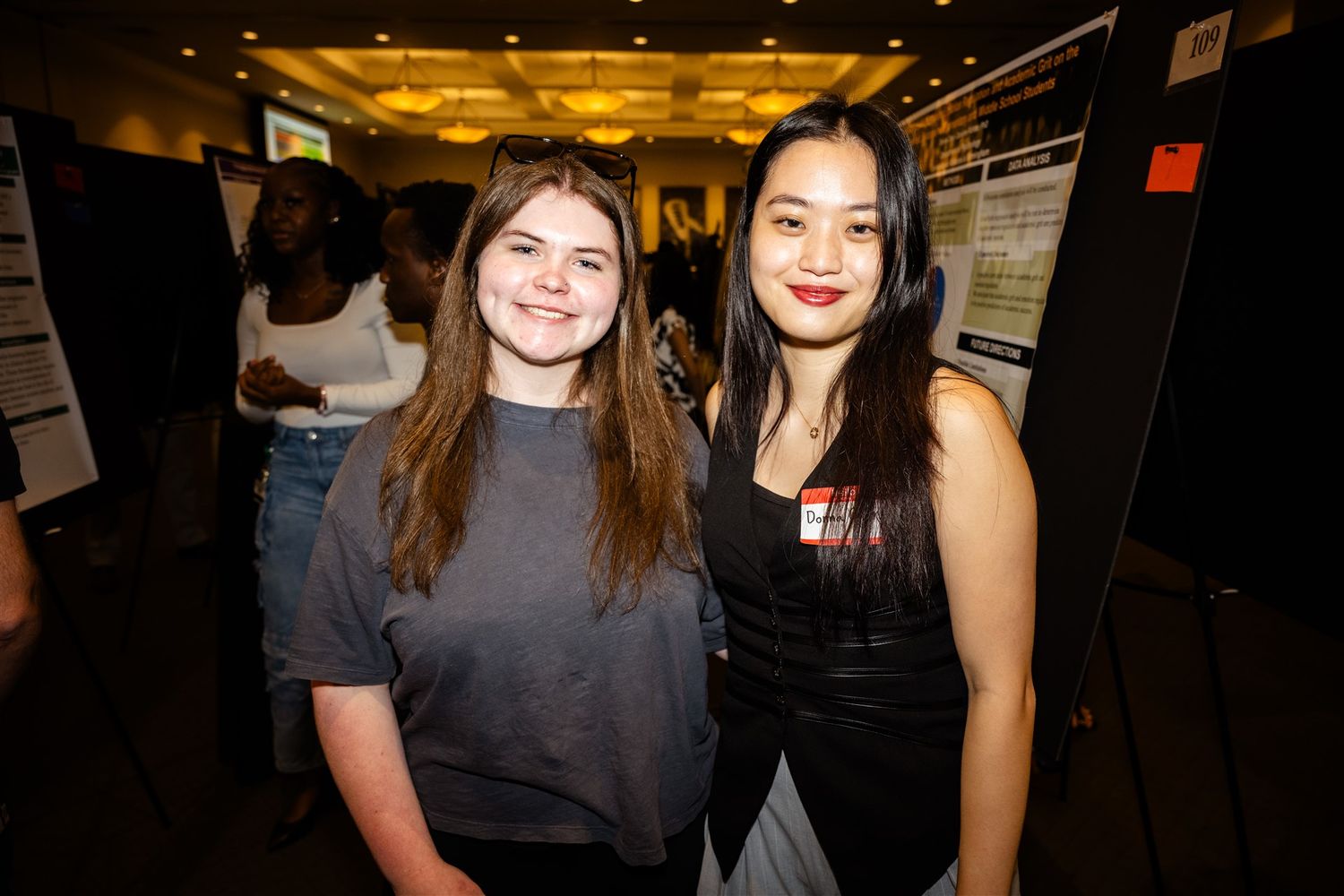 University of Alabama at Birmingham event photography, UAB Expo event photography, two women smiling at research expo in  Birmingham.
