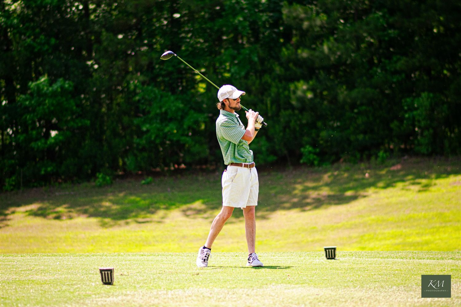Main swinging golf club at golf tournament, professional event photography, affordable corporate event photography in Birmingham Alabama.