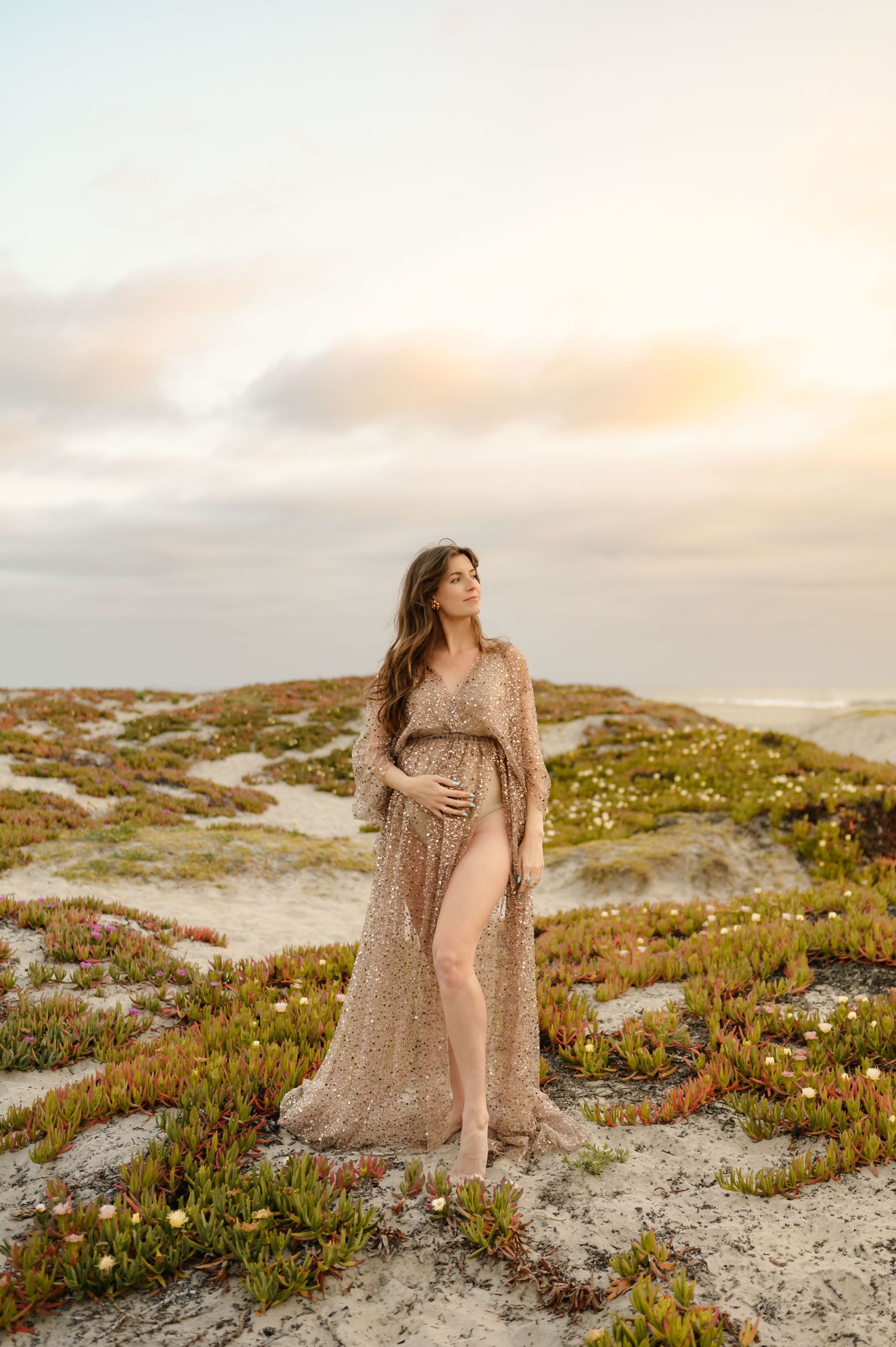 Zachari Dunes on Mandalay Beach maternity photoshoot, Ventura Photographer Tiffany Kelterer of mom posed on sand dunes