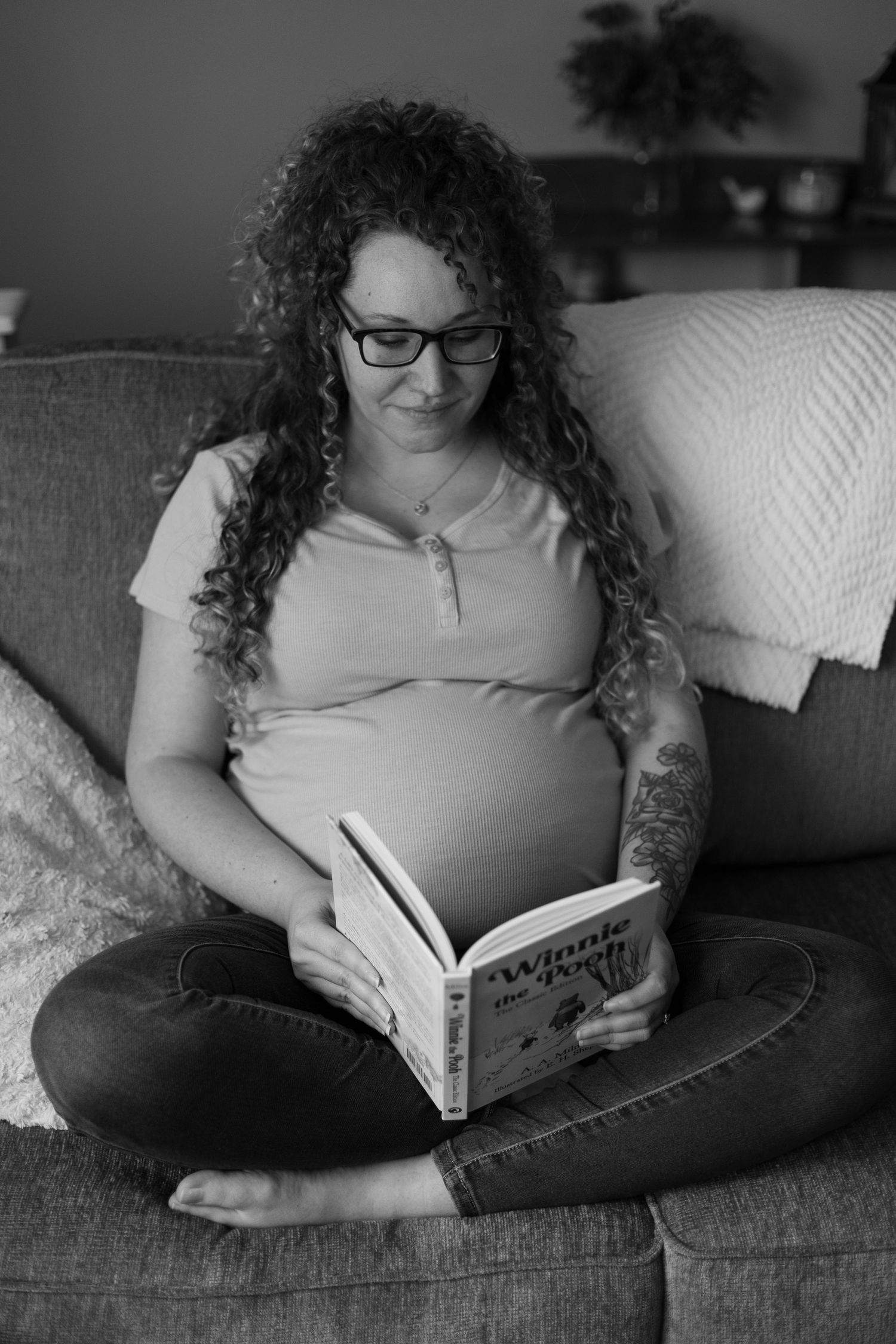 An expectant mother looking through her future child's book.