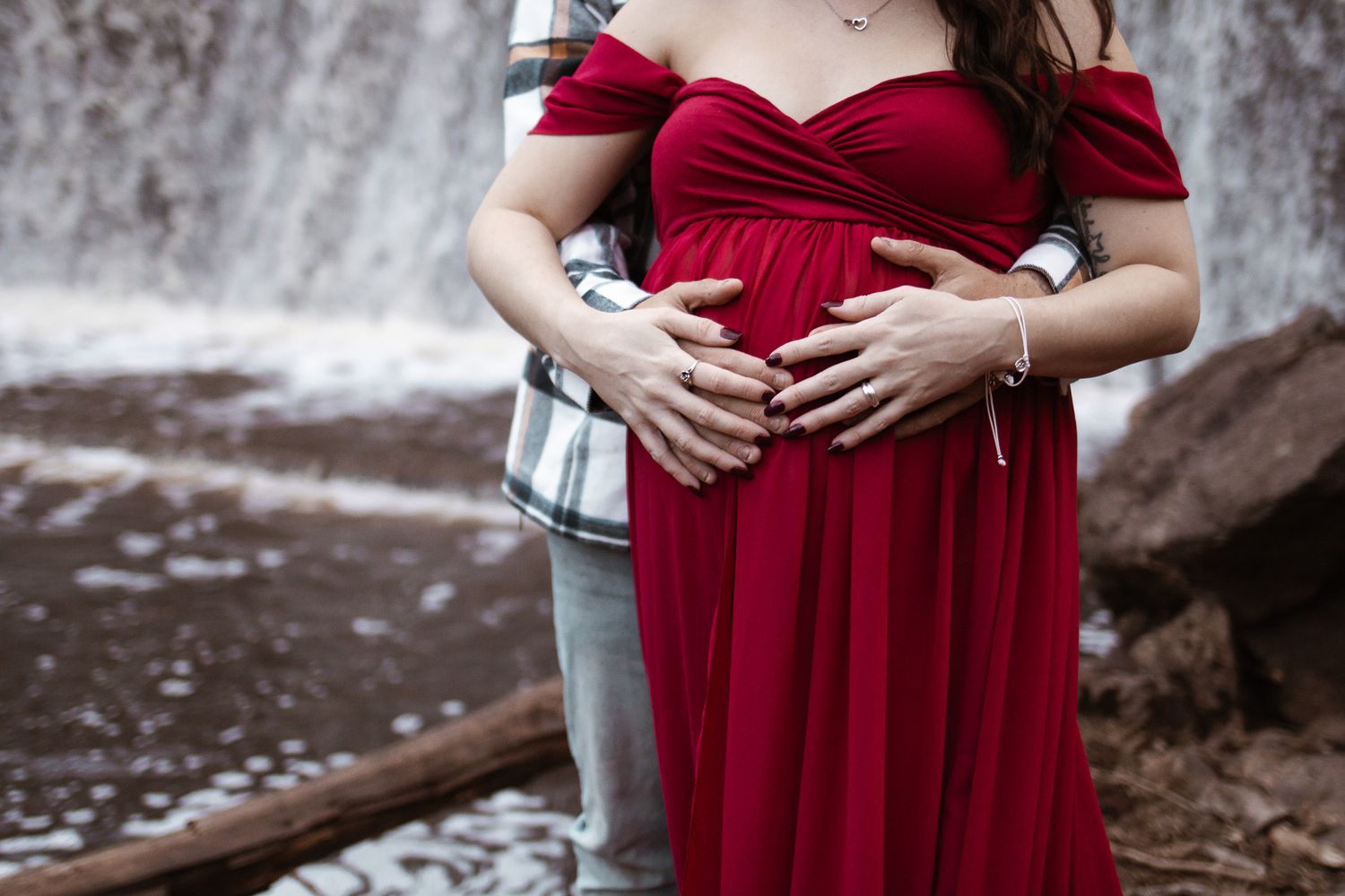maternity photo, mom and dad holding mom's belly, arms wrapped around mom.