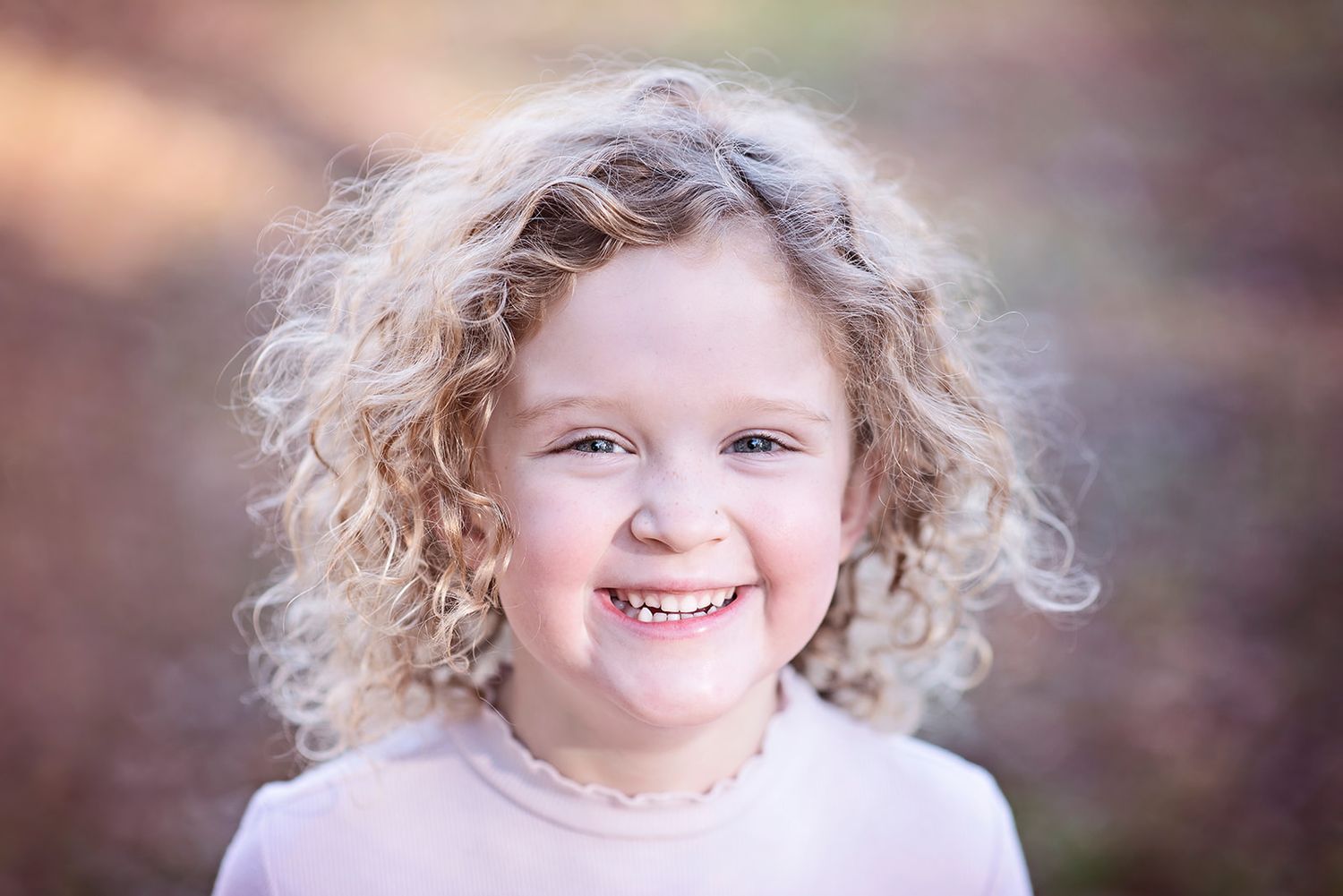Close up portrait of a little girl outdoors for family photos near Halifax PA in Dauphin County.