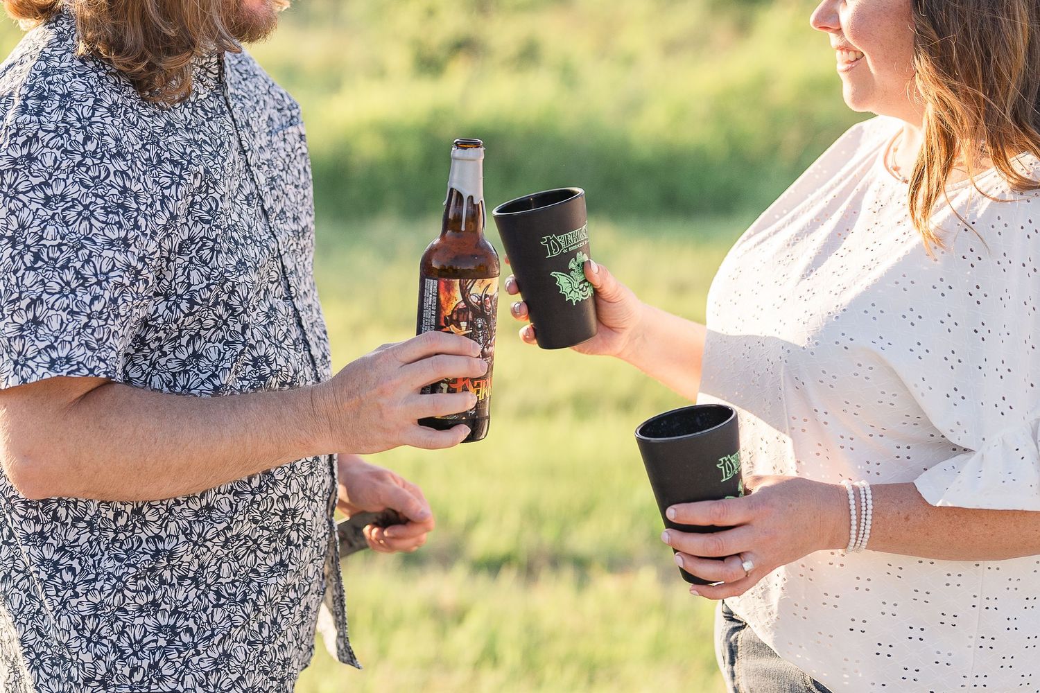 Engaged couple pouring darklord beer during their Kenosha engagement session.
