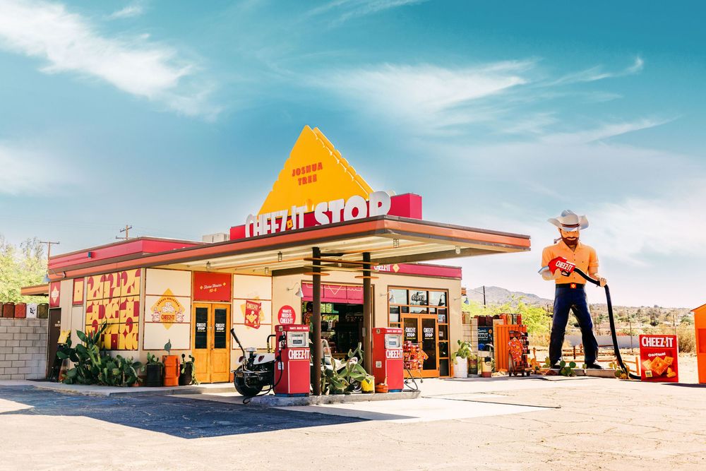 Retro-style gas stations and desert buildings line up against a bright blue sky in a panoramic collage.