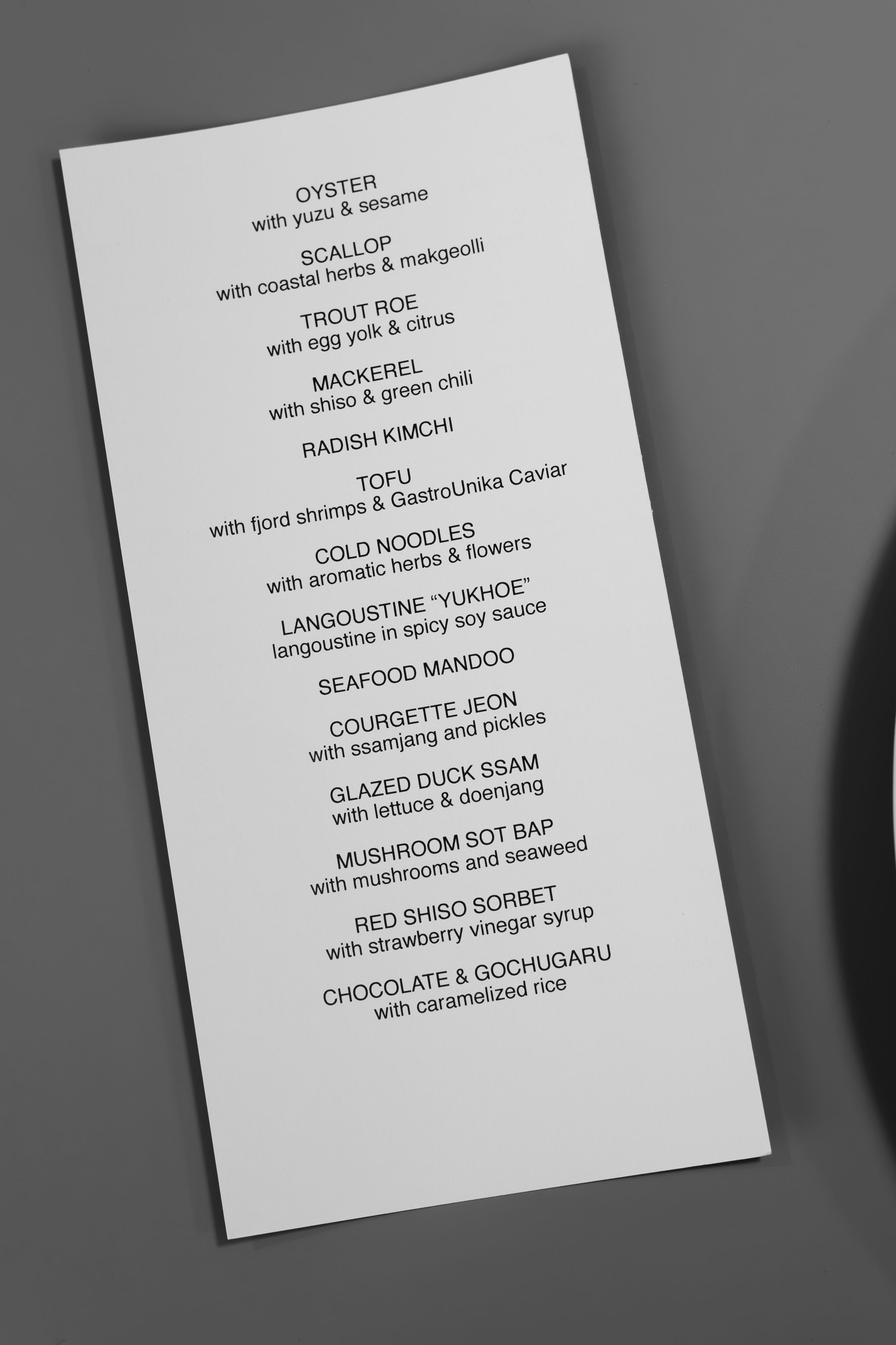 Fine dining tasting menu featuring seafood and Asian-inspired dishes.