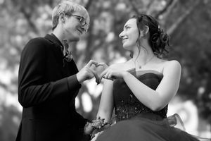 A romantic black and white collage of dancing couples in formal attire at a wedding or ballroom event.
