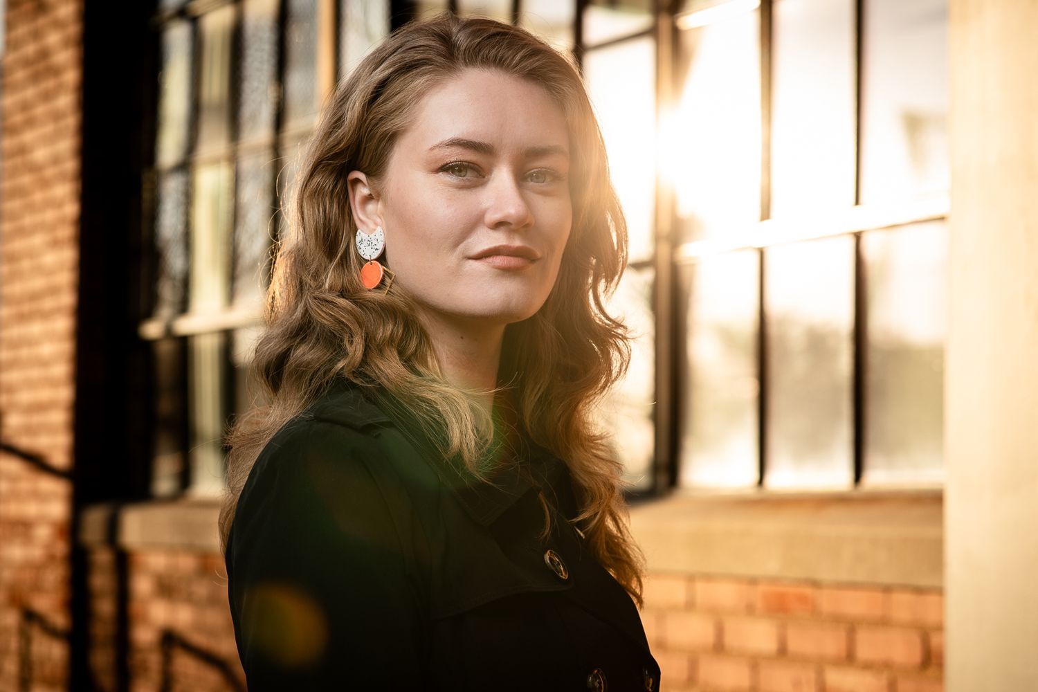 Beautiful outdoor portrait photography; woman with sunset window; Clarissa Anello