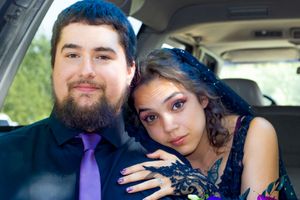 A couple shares intimate moments in a car photoshoot sequence with natural lighting.