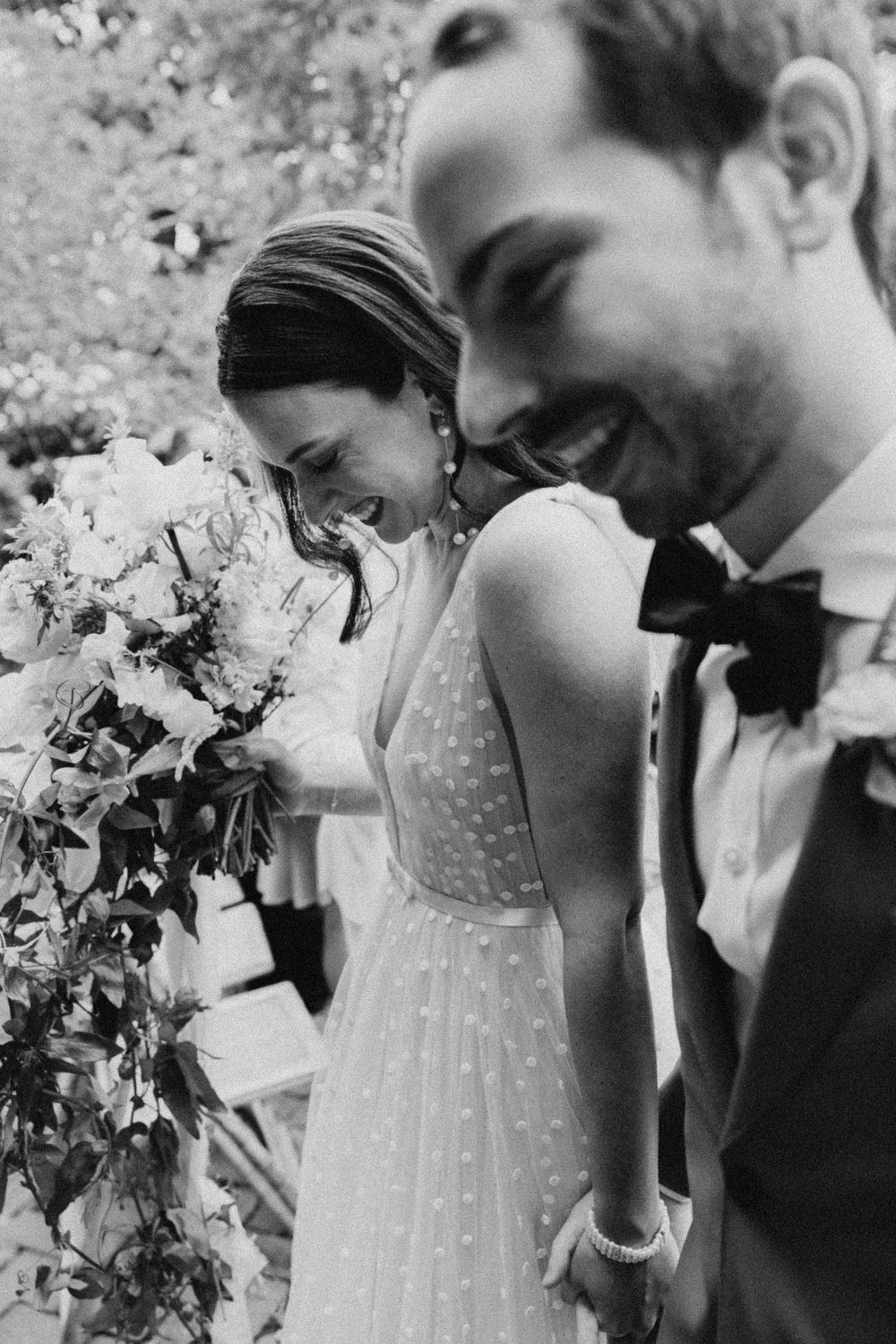 Black and white wedding photo sequence showing a couple laughing with floral bouquet.