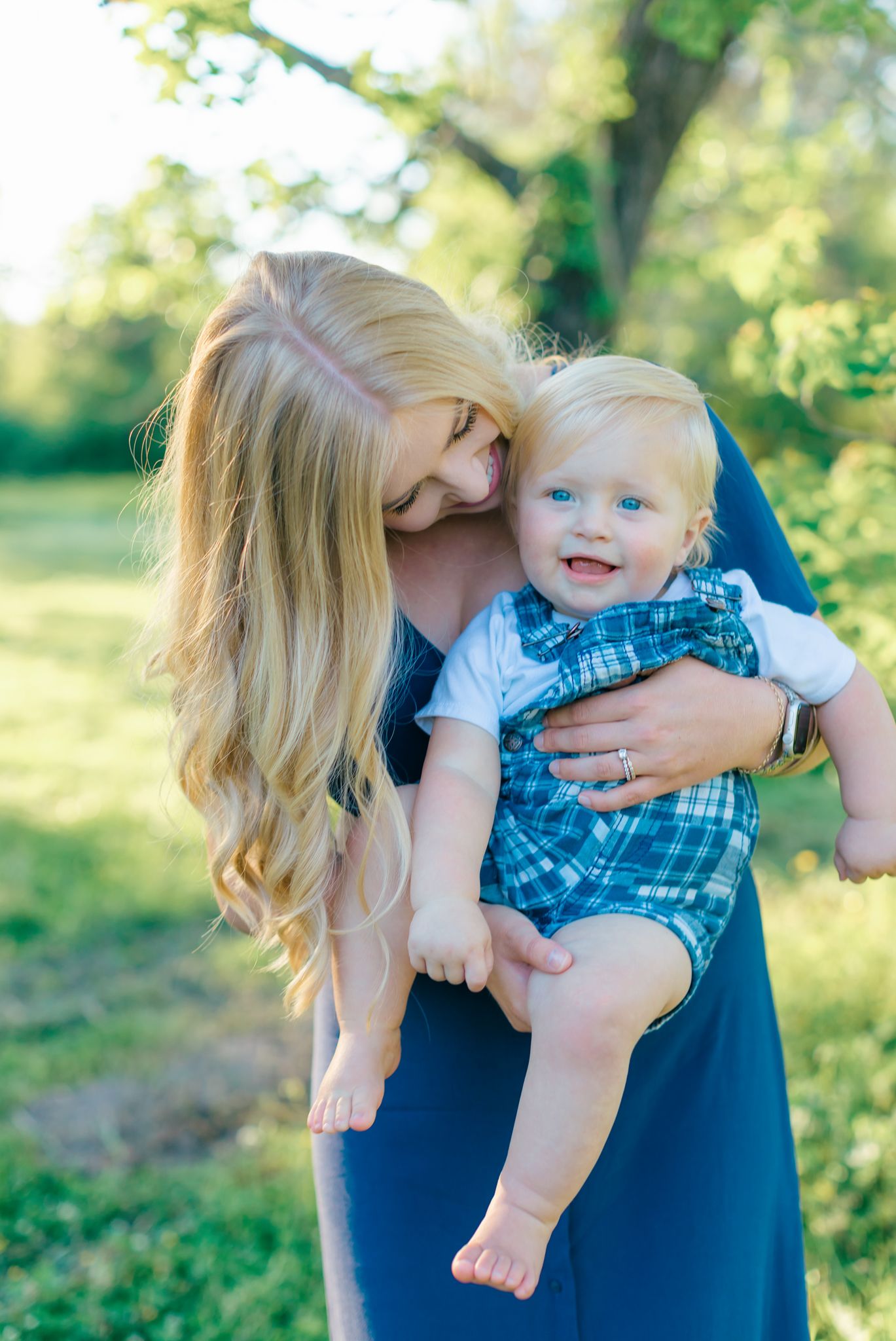 sweet baby smiles with mom