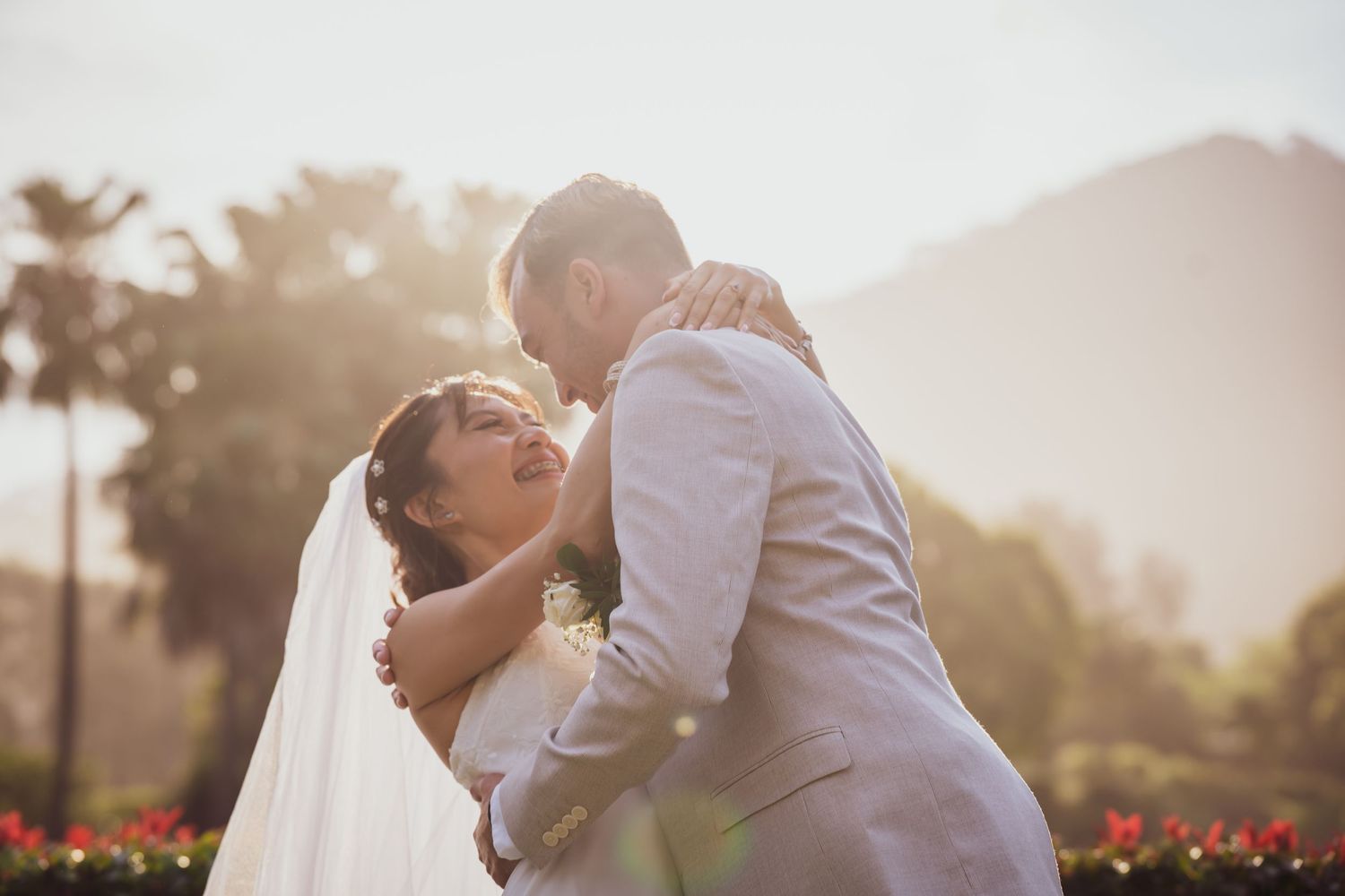 Romantic sunset wedding portraits captured in golden hour lighting.