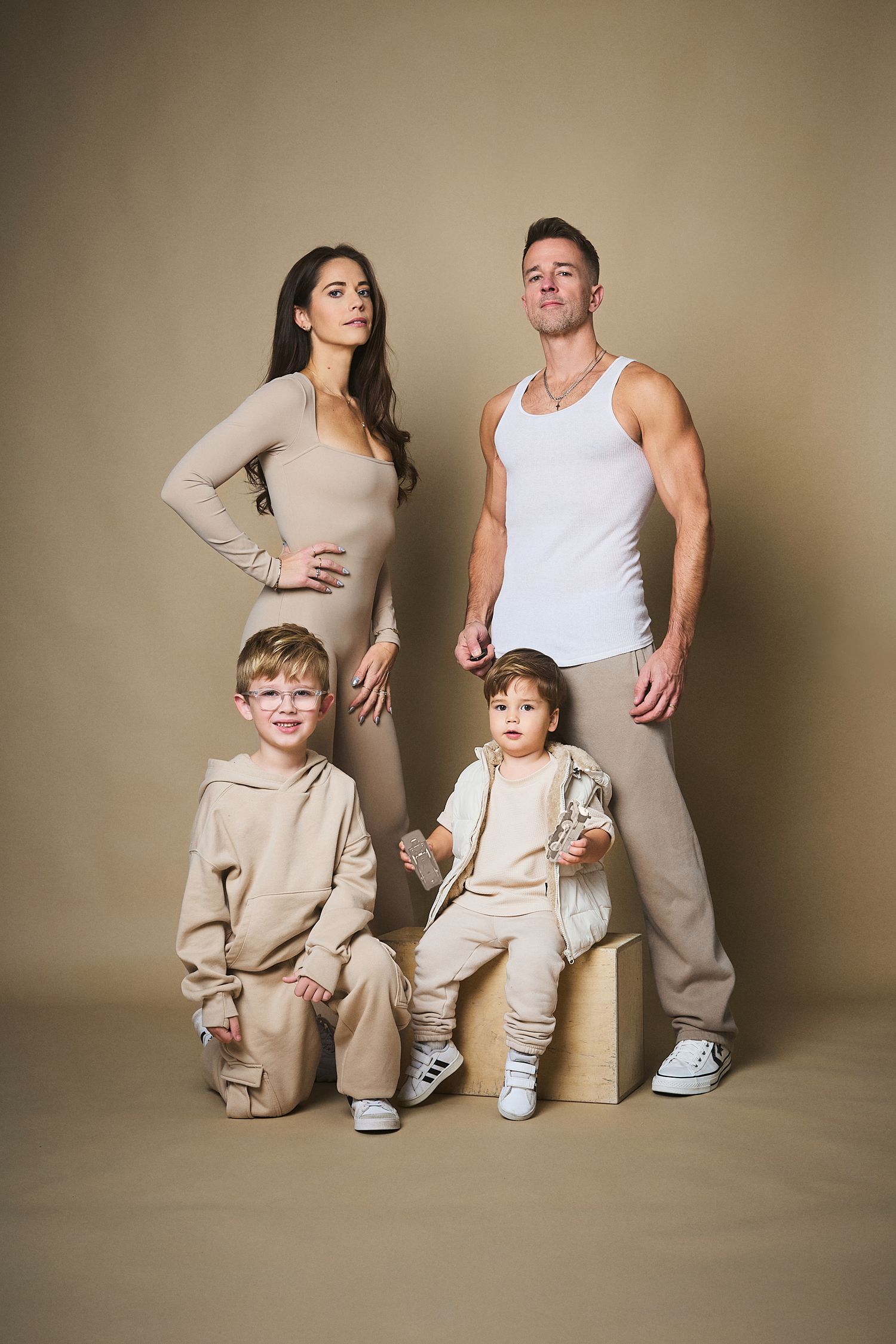 Family Portrait of Curtis & Cort Photography in monotoned beiges