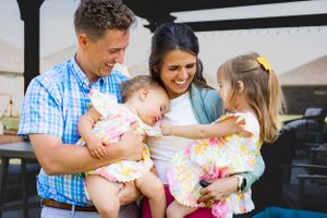 Happy family gathering with parents and children sharing joyful moments.