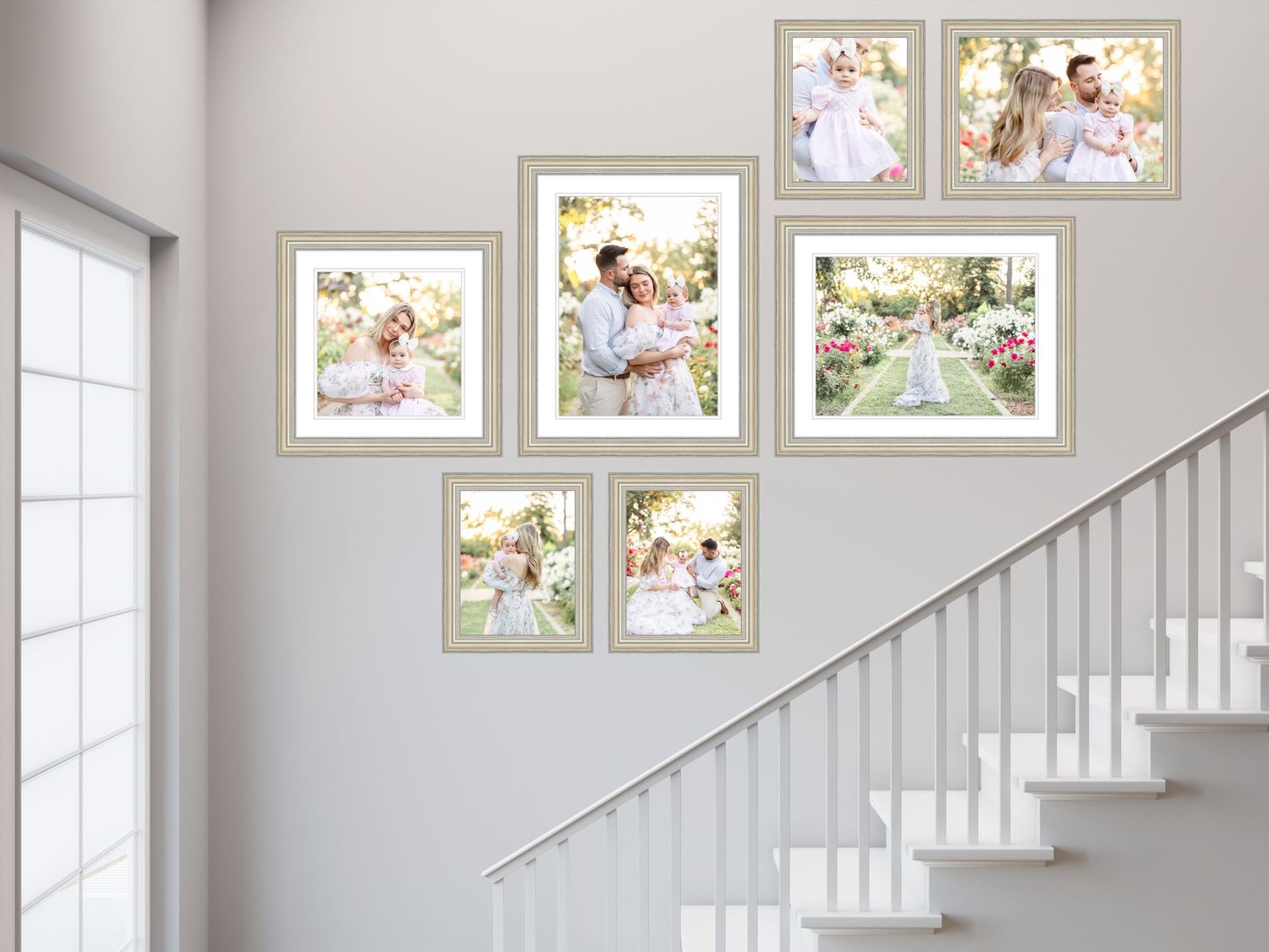 Clean white stairway with gallery wall featuring framed photos in a contemporary home design.