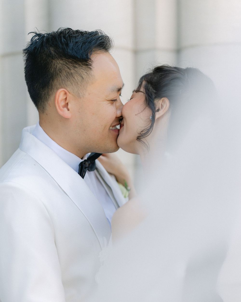 bride and groom sharing an intimate moment during a soft wedding portrait