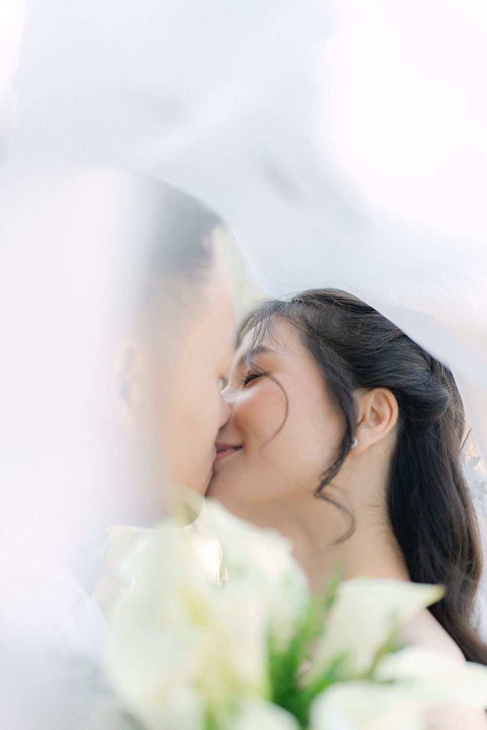 soft bridal portrait with white florals during an intimate wedding moment