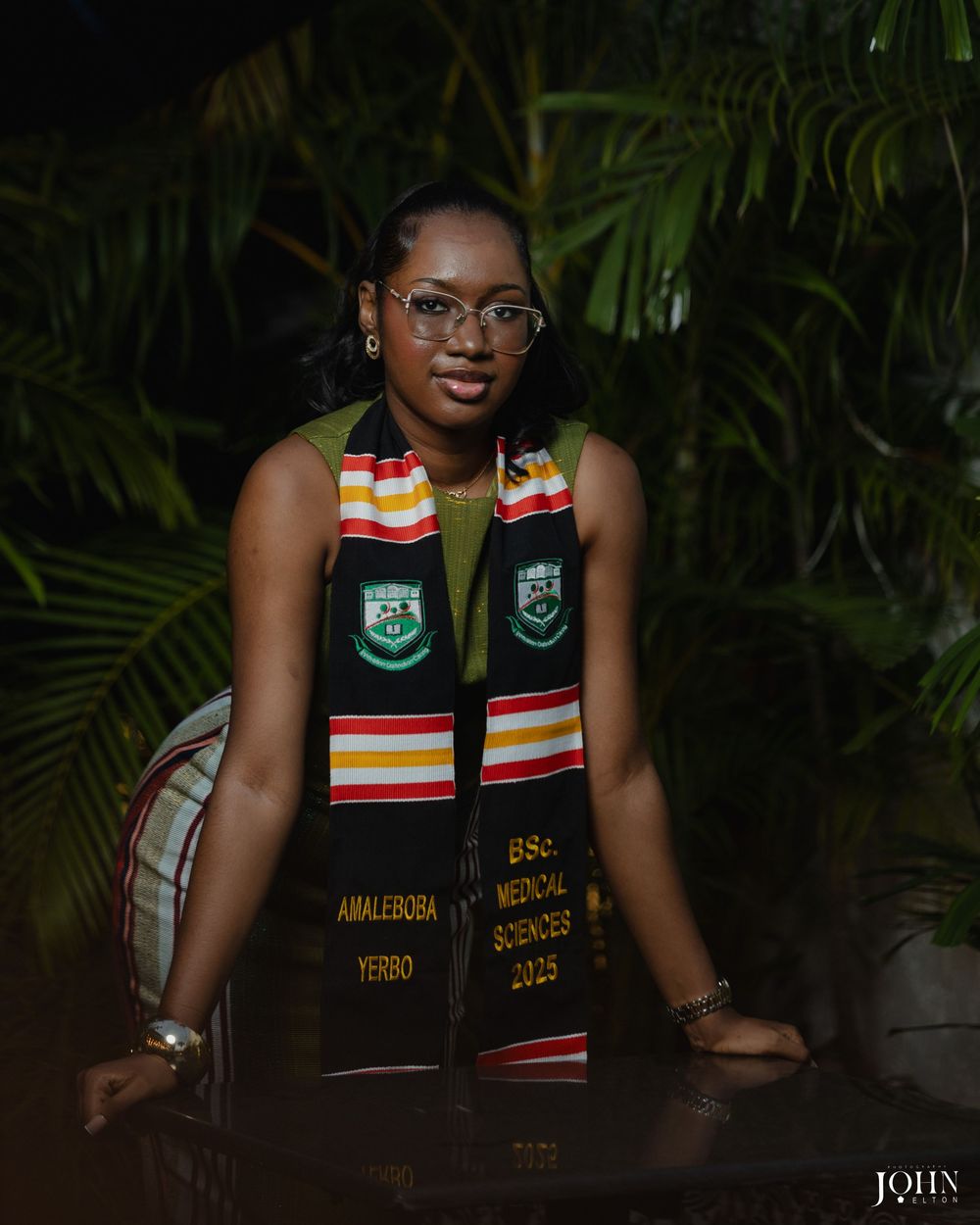 A series of graduation portraits showing a graduate in a black stole with colorful stripes against a dark background.
