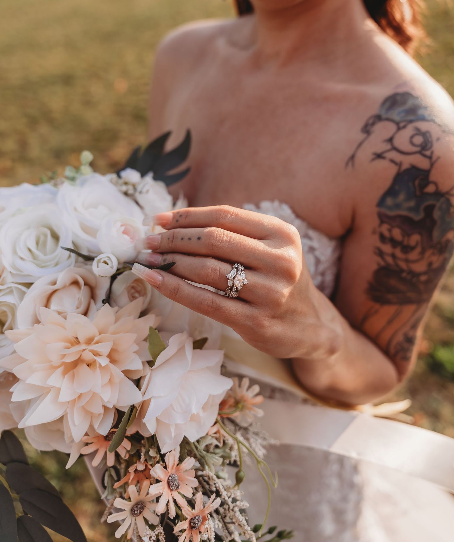 Close-up details of a delicate lace wedding dress with intricate patterns.