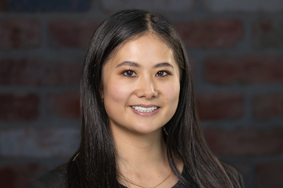 Business professional headshot with confident expression and studio lighting”