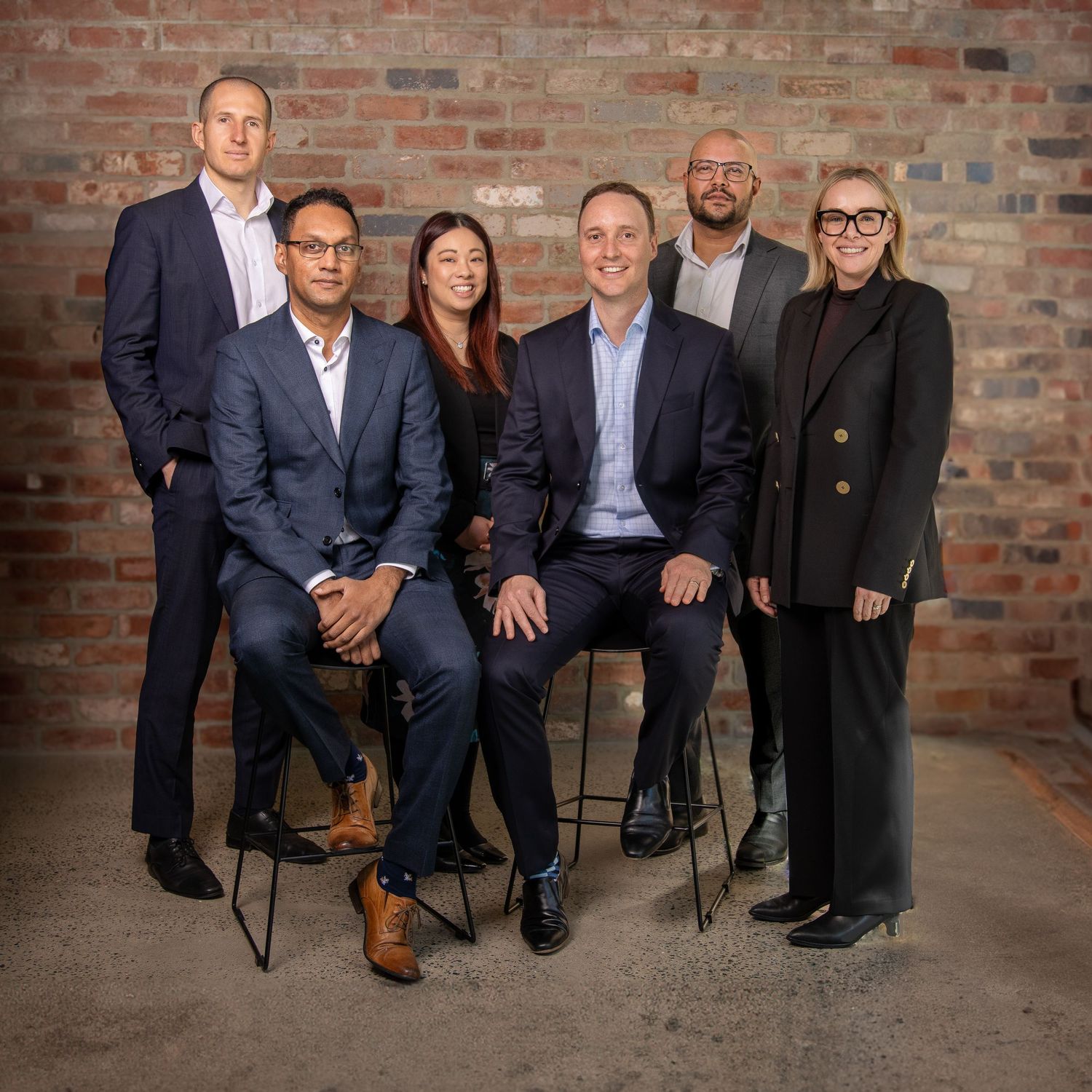 Business professional headshot with confident expression and studio lighting”