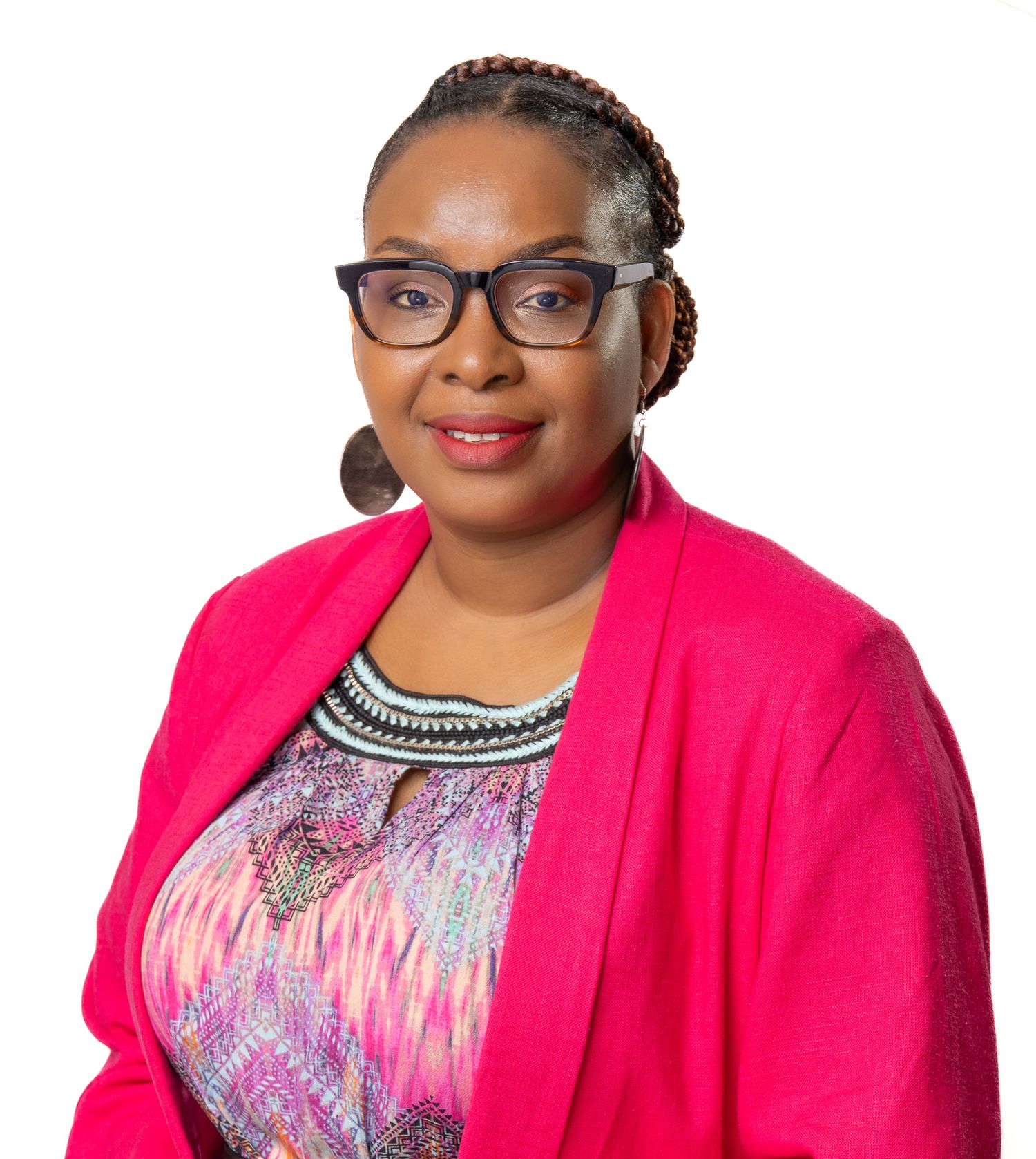 Business professional headshot with confident expression and studio lighting