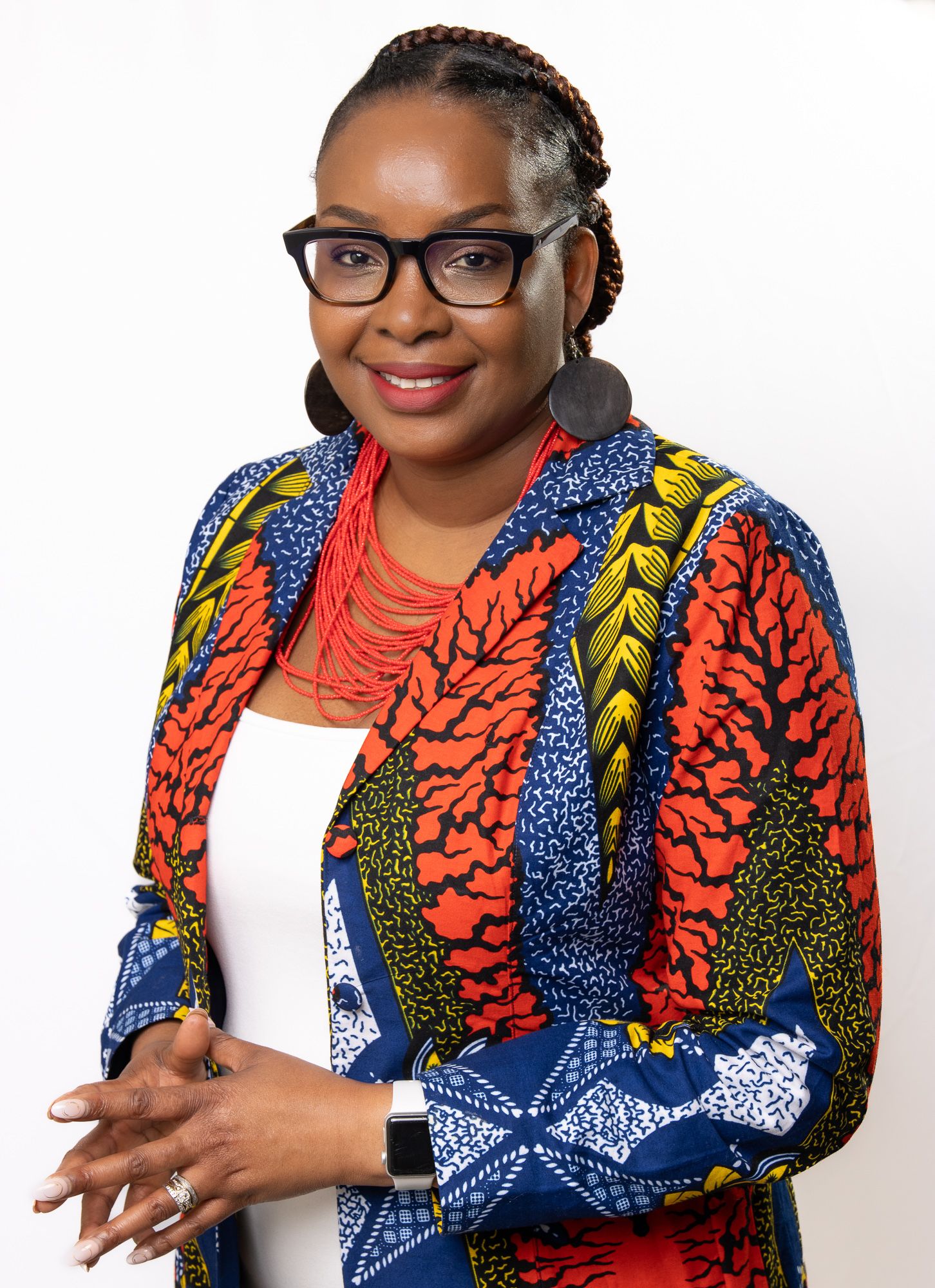 Business professional headshot with confident expression and studio lighting