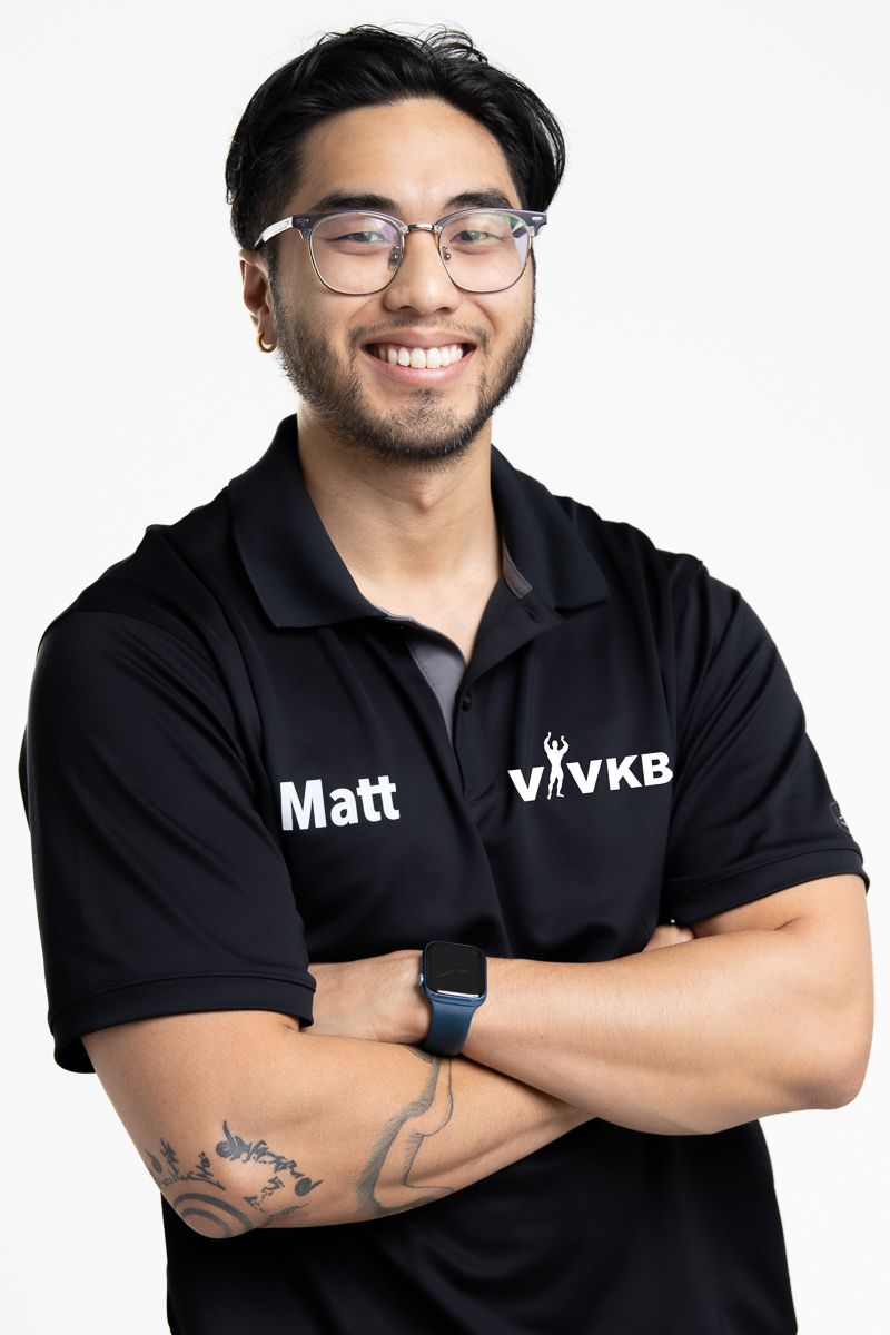 Business professional headshot with confident expression and studio lighting