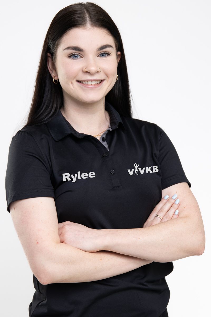 Business professional headshot with confident expression and studio lighting
