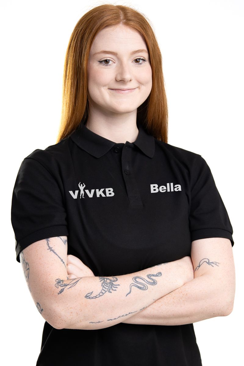 Business professional headshot with confident expression and studio lighting