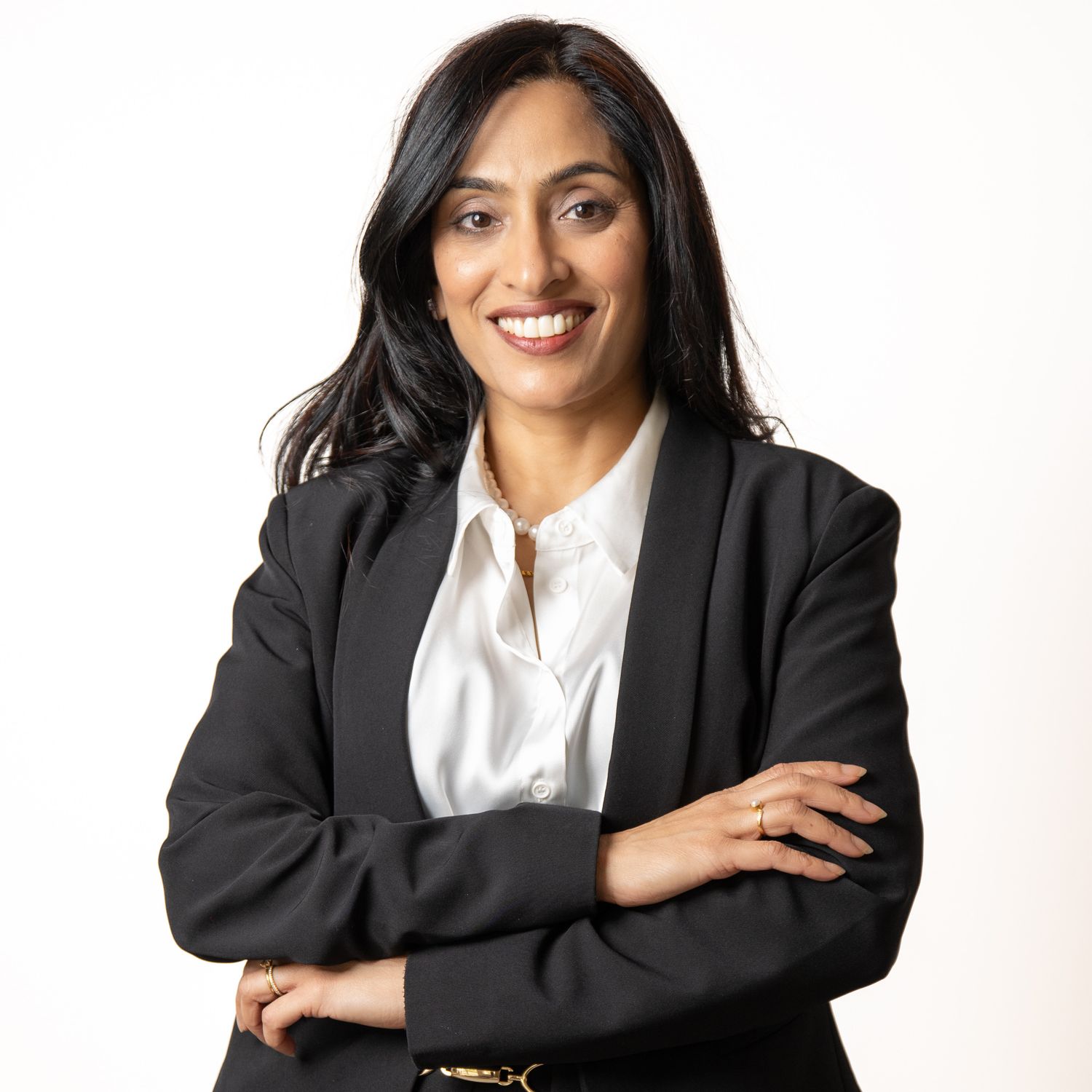 Business professional headshot with confident expression and studio lighting