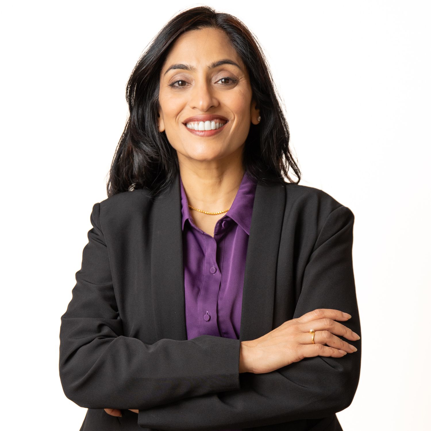 Business professional headshot with confident expression and studio lighting
