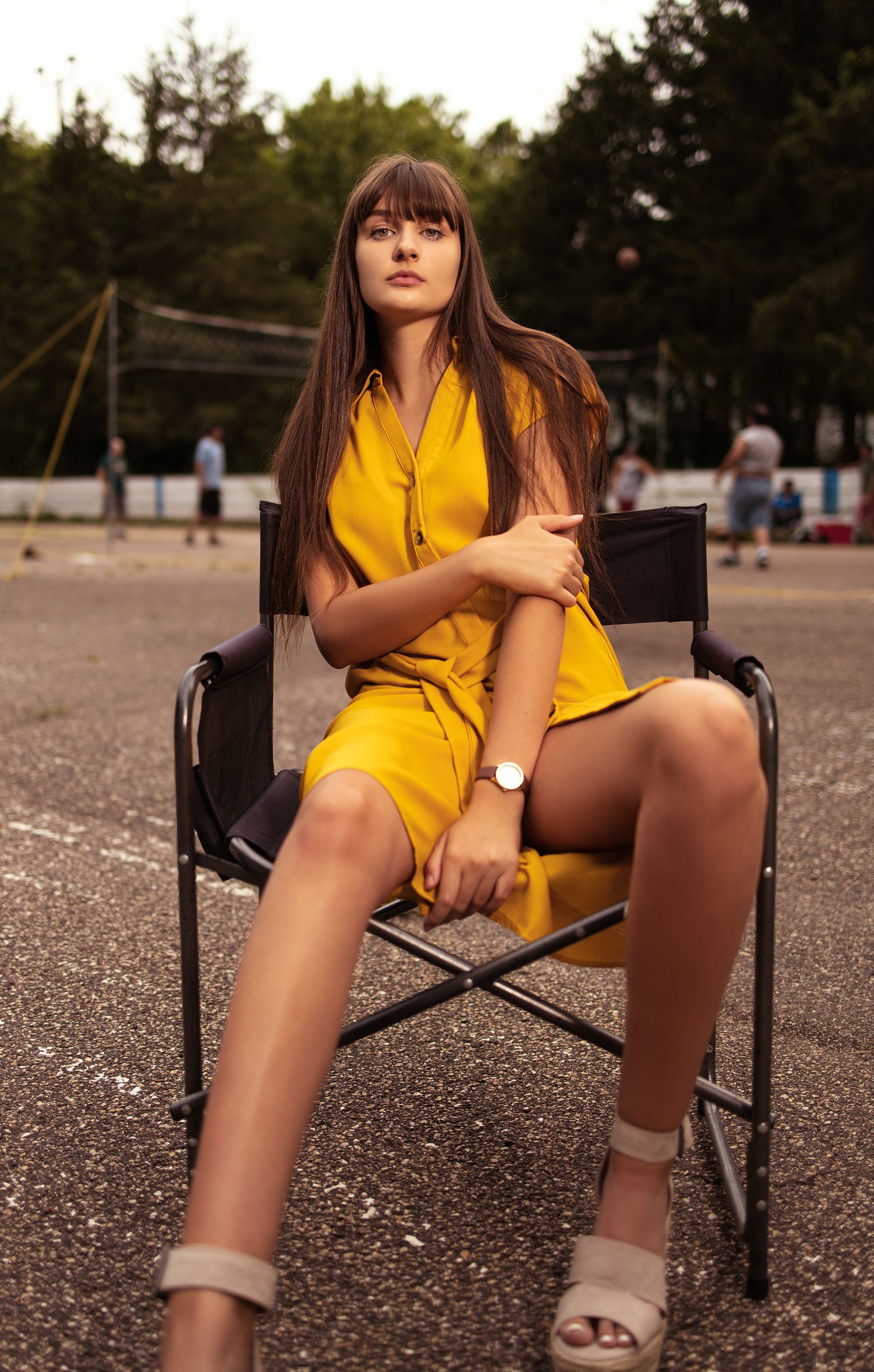 beautiful female model sitting down posing for her fashion photograph banana republic dress