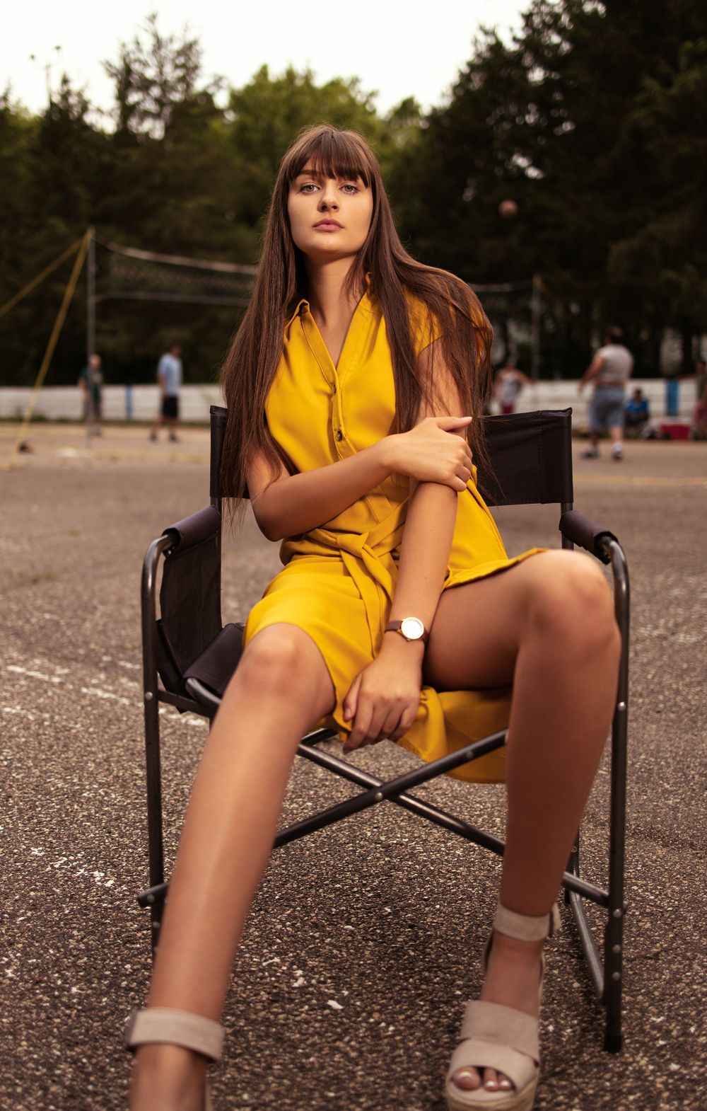 beautiful female model sitting down posing for her fashion photograph banana republic dress