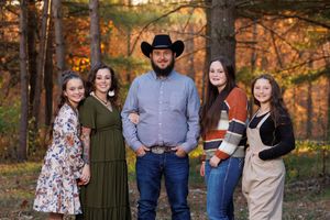 One man and four girls. Girl dad life with a fall backdrop.