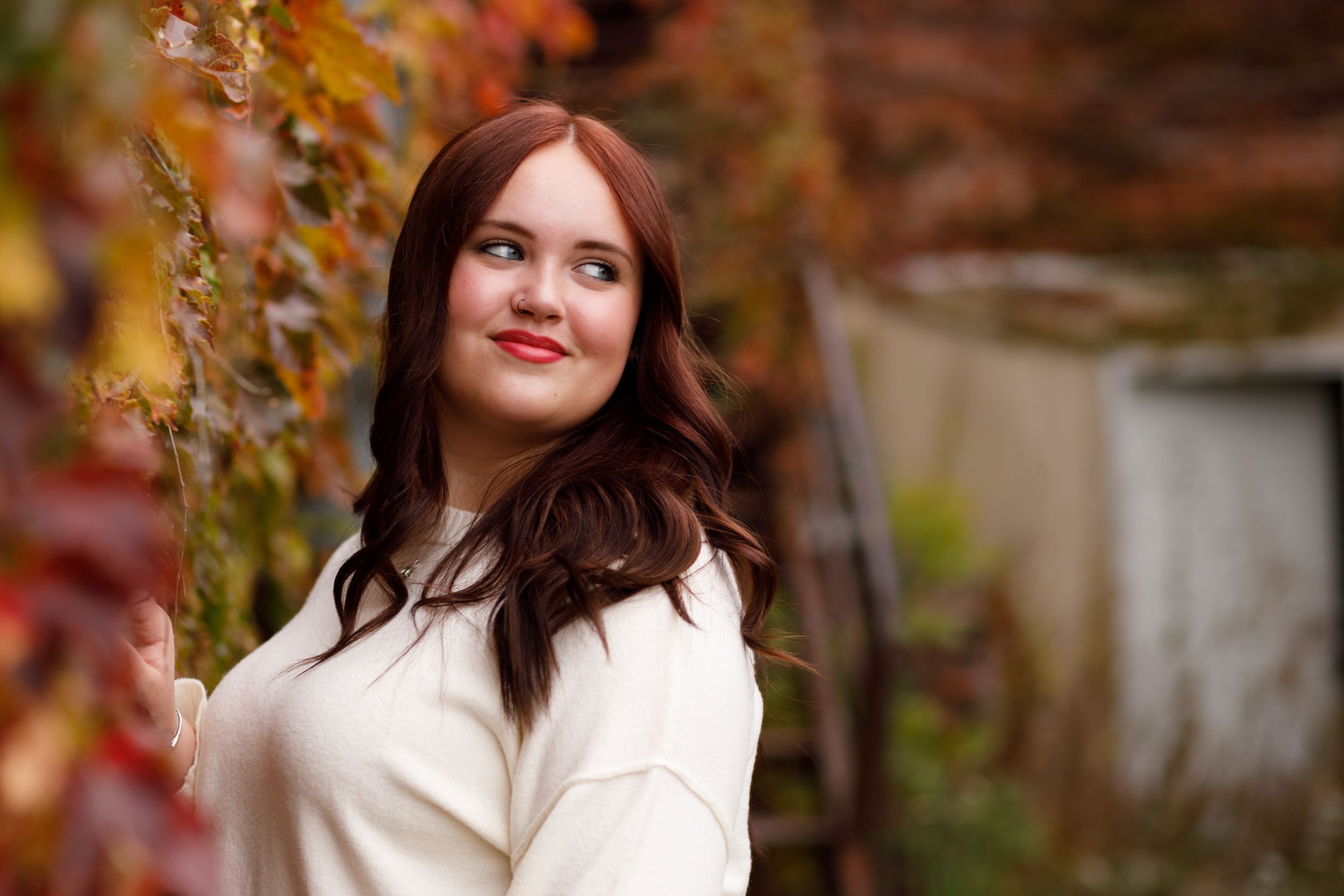 High School senior girl in a lovely white sweater.