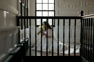 Bride sniffing her bouquet