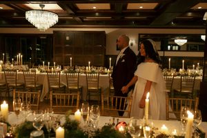 Husband and wife seeing their candle lit reception for the first time.