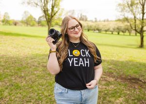 branding picture of local photographer showing off her new shirt