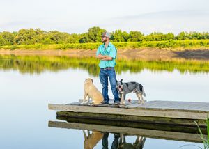photo of boy for his small business with his dogs