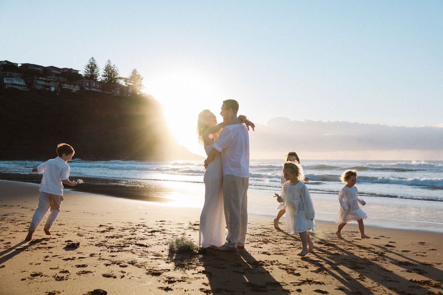 Family Photography - Happy big Family shoot at Bilgola Beach, Northern Beaches, Sydney - Kids running around parents