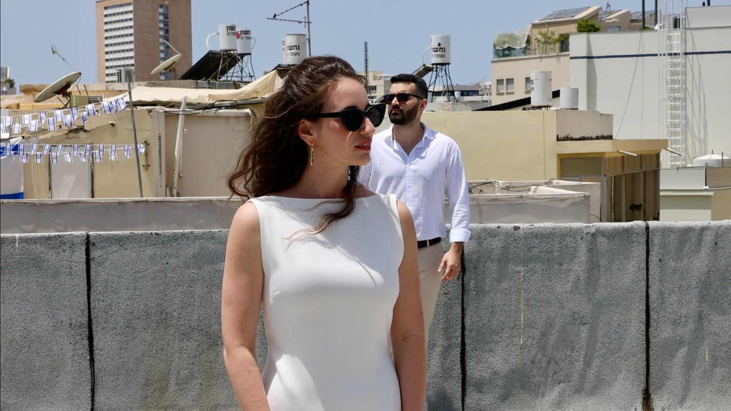 Bride and Groom having a fashion moment, while wearing sunglasses in a rooftop in tel aviv